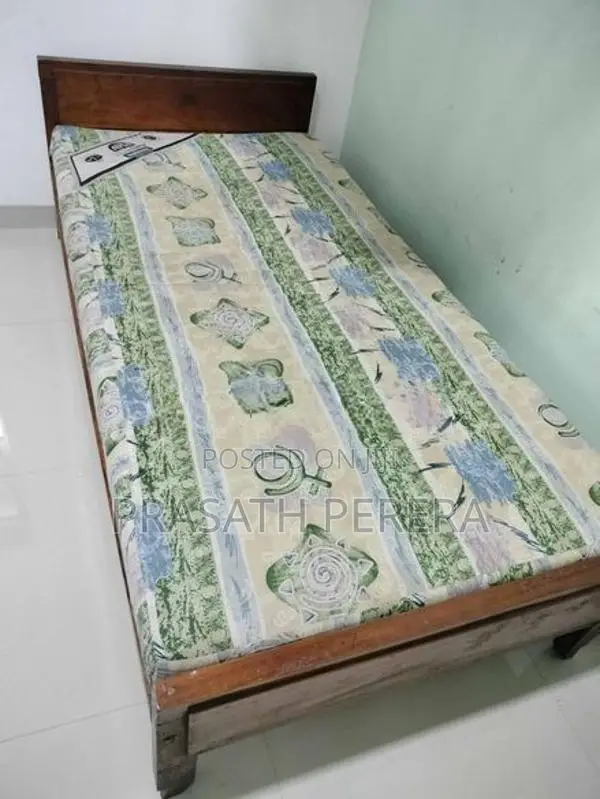 One Used Wooden Bed