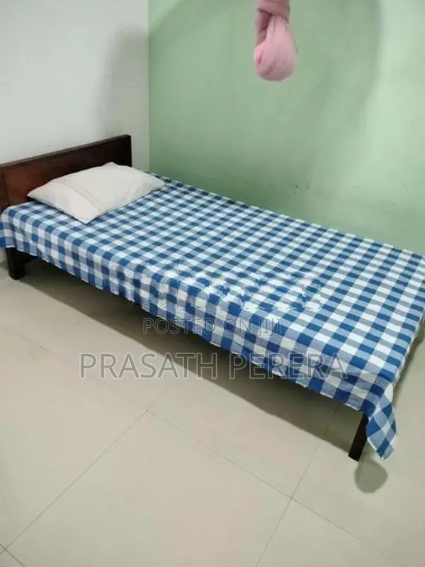 One Used Wooden Bed