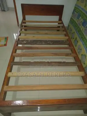 One Used Wooden Bed
