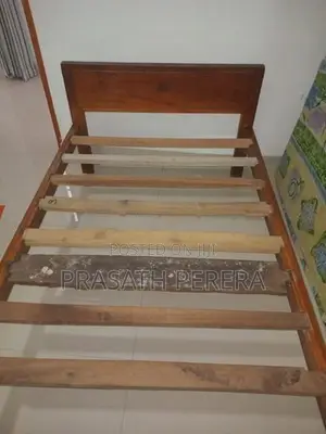 One Used Wooden Bed