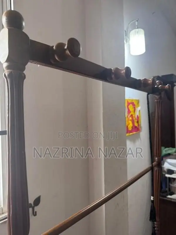 Teak clothes rack with a hanger