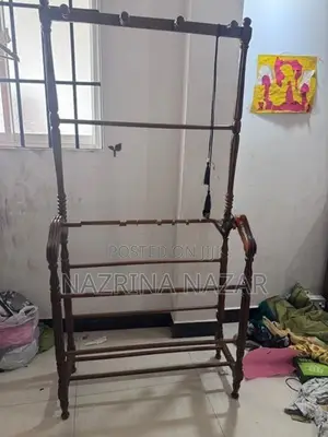 Teak clothes rack with a hanger