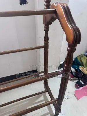 Teak clothes rack with a hanger
