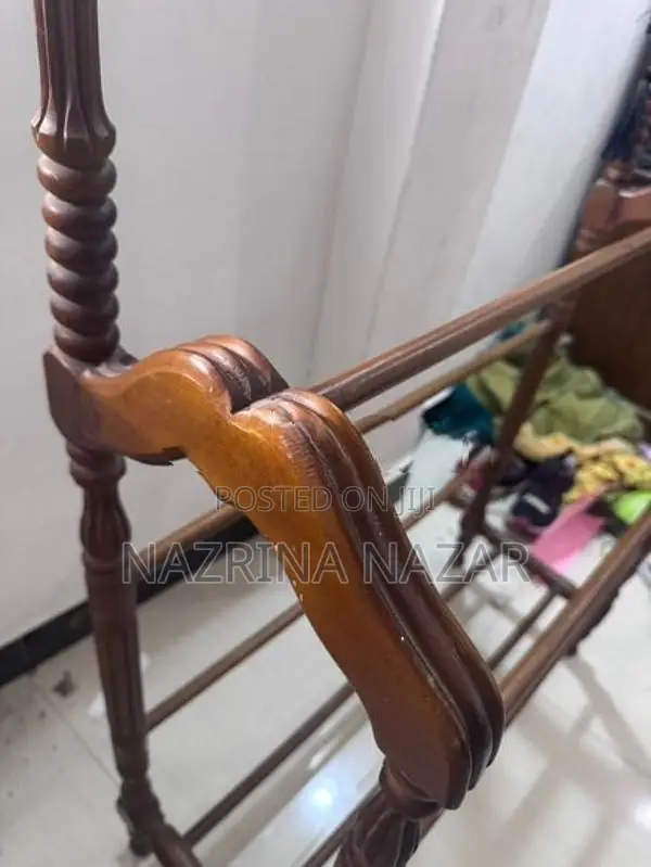 Teak clothes rack with a hanger
