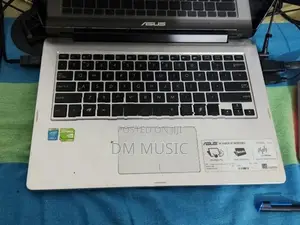 Asus Transformer Book Flip TP300L Series Laptop with a Moniter