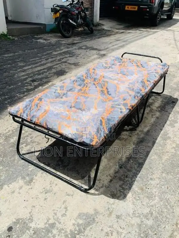 Folding bed with mattress
