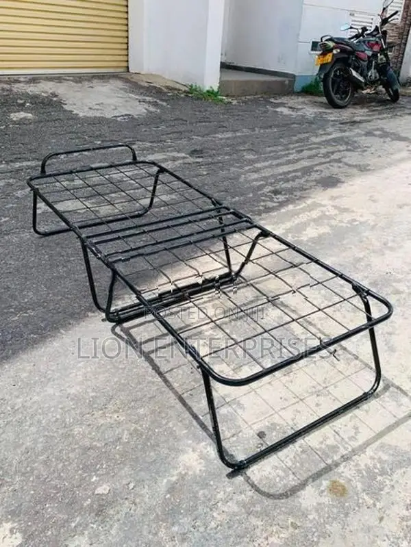 Folding bed with mattress