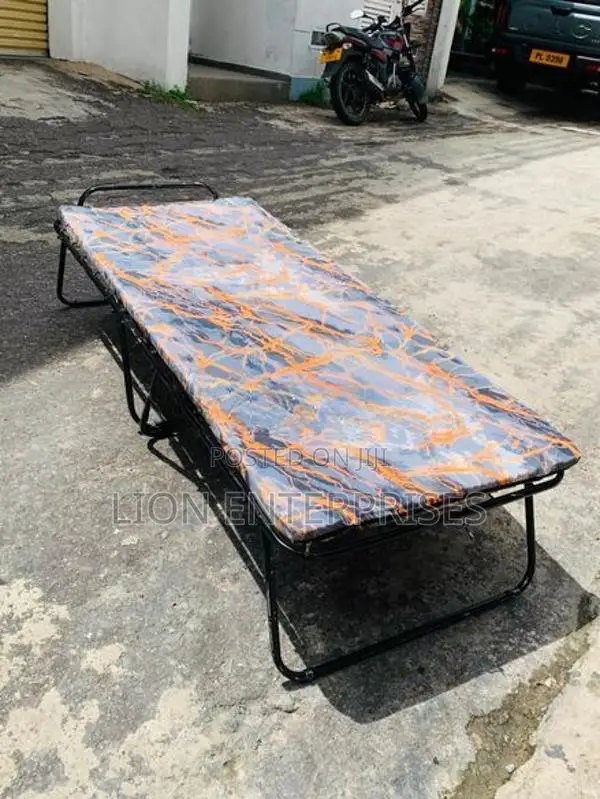 Folding bed with mattress
