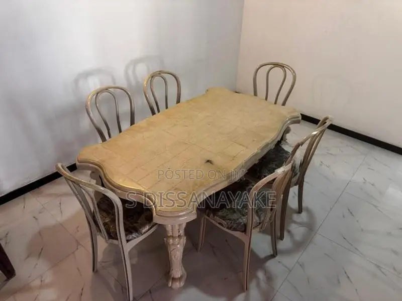 Dinning Table with 6 Cusion Chairs