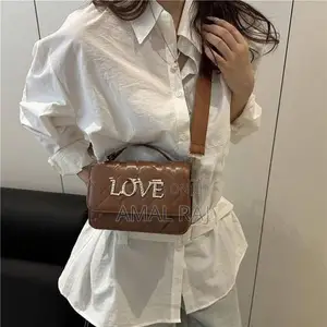 Crossed Hand Bag