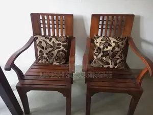 Two Teak Wooden Chairs
