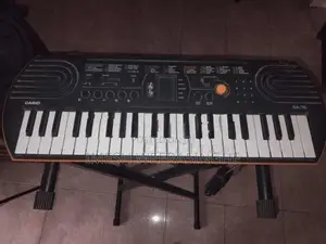 Casio SA-76 Mini Keyboard With Adjustable X-Stand Power Adapter