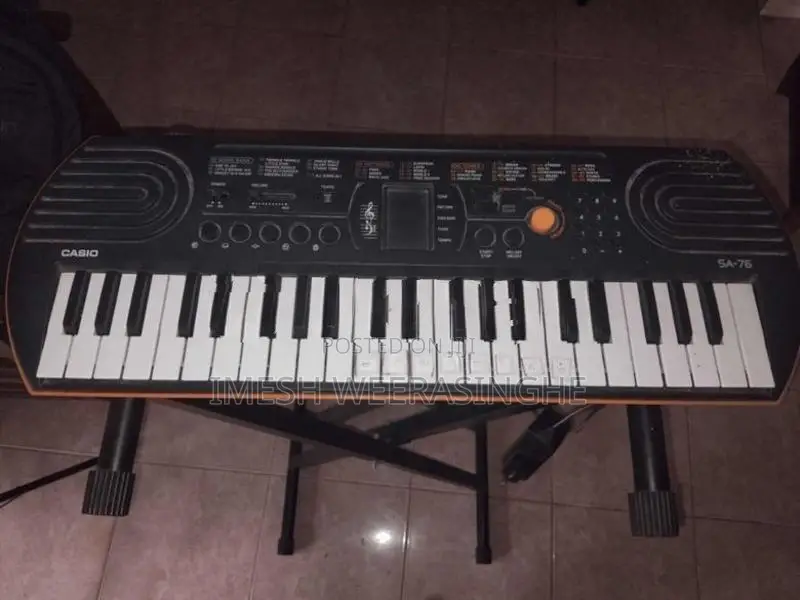 Casio SA-76 Mini Keyboard With Adjustable X-Stand Power Adapter