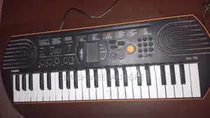 Casio SA-76 Mini Keyboard With Adjustable X-Stand Power Adapter