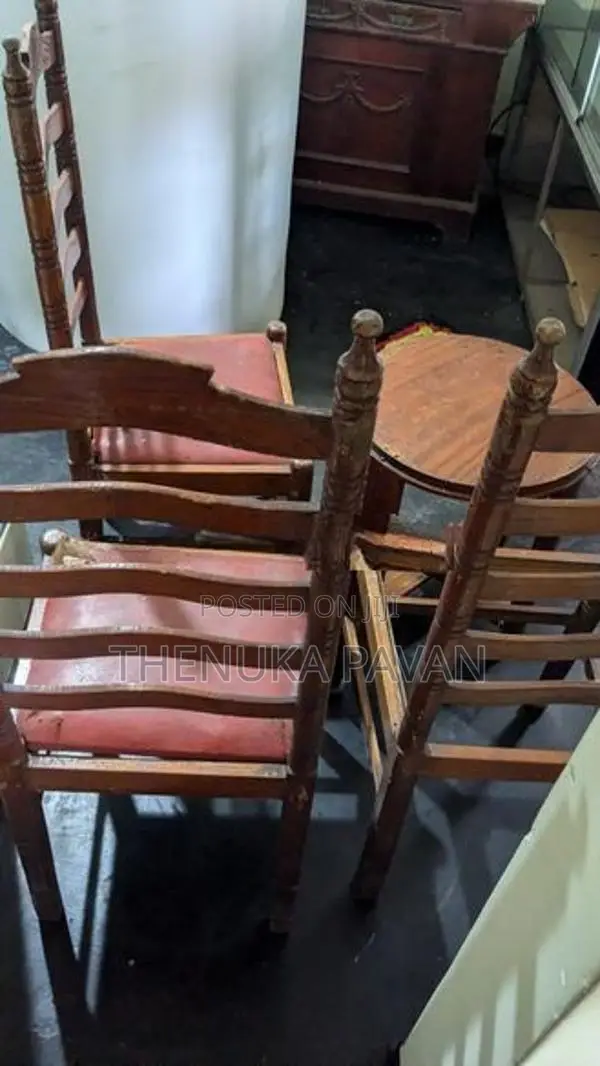 3 Wooden High-Back Chairs With Round Side Table