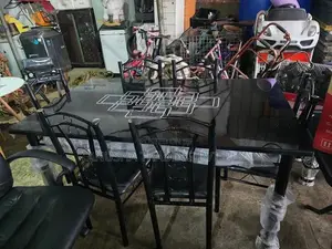 ​ Elegant 6-Seater Black Glass Dining Table