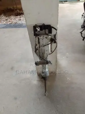 Hand-Held Pneumatic Rock Drill