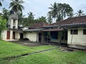 Gampaha - Hiripitiya Large Coconut Land with a House for Sale