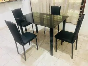 Glass Top Dining Table With 4 Cushion Chairs
