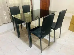 Glass Top Dining Table With 4 Cushion Chairs