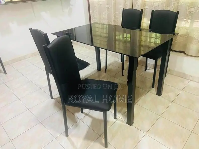 Glass Top Dining Table With 4 Cushion Chairs