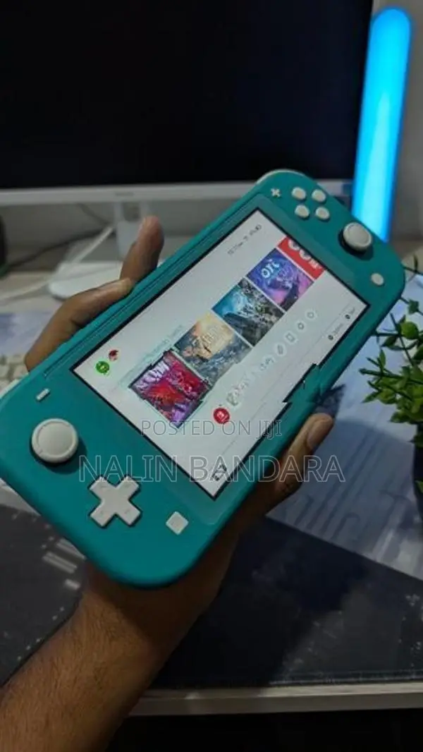 Turquoise Nintendo Switch Lite With Animal Crossing