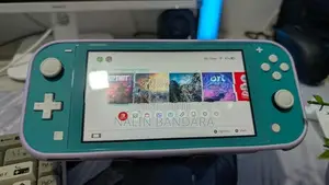 Turquoise Nintendo Switch Lite With Animal Crossing