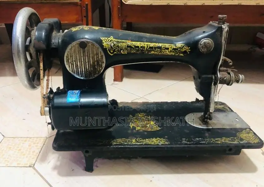 Old Singer Sewing Machine With Heavy-Duty Black Steel Stand